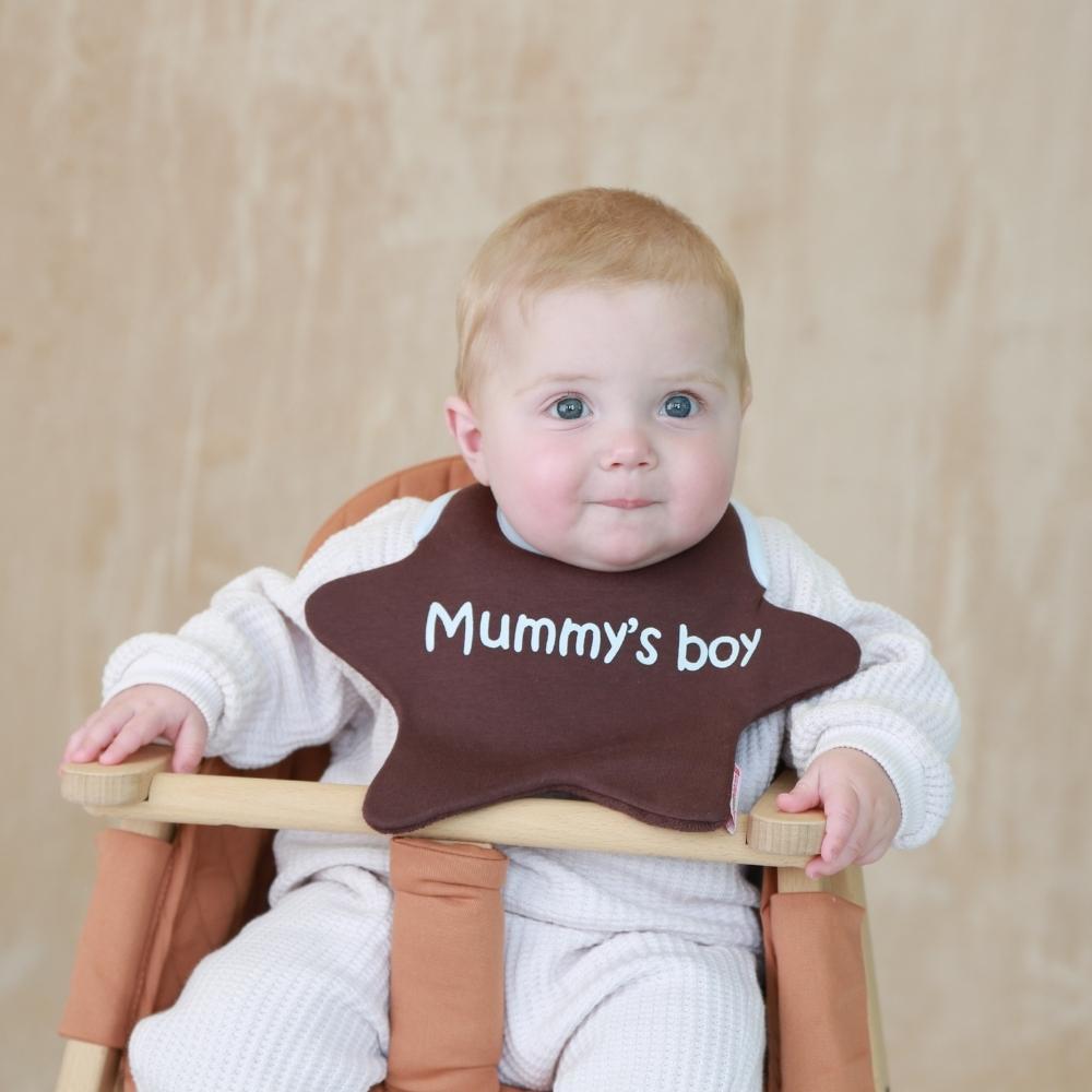 Mummy's boy bib on baby boy in high chair
