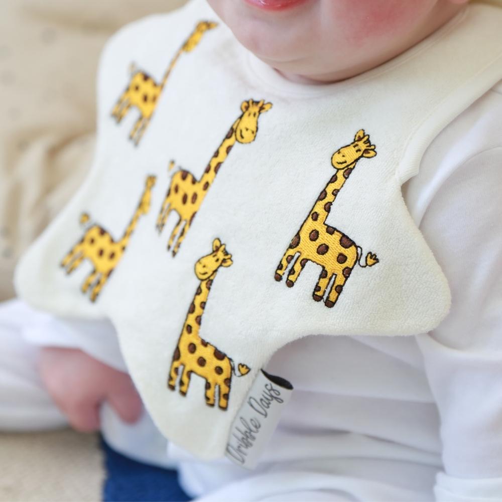 Dribble bib with embroidered giraffes