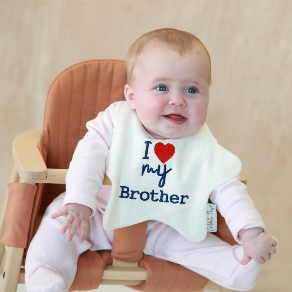 Baby wearing 'I love my brother' bib